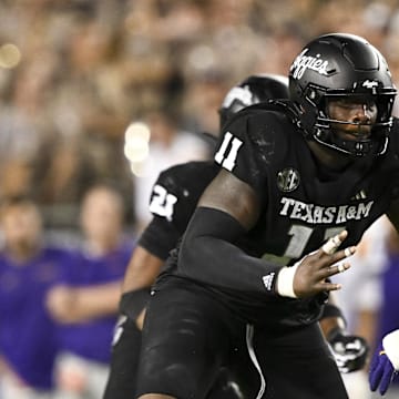 Texas A&M Aggies defensive lineman Nic Scourton (11) attacks LSU offensive tackle Will Campbell.