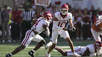 Nov 22, 2025; Austin, Texas, USA; Arkansas Razorbacks quarterback Taylen Green (10) hands the ball off to running back Mike Washington Jr. (4) during the first half against the Texas Longhorns at Darrell K Royal-Texas Memorial Stadium. Mandatory Credit: Scott Wachter-Imagn Images