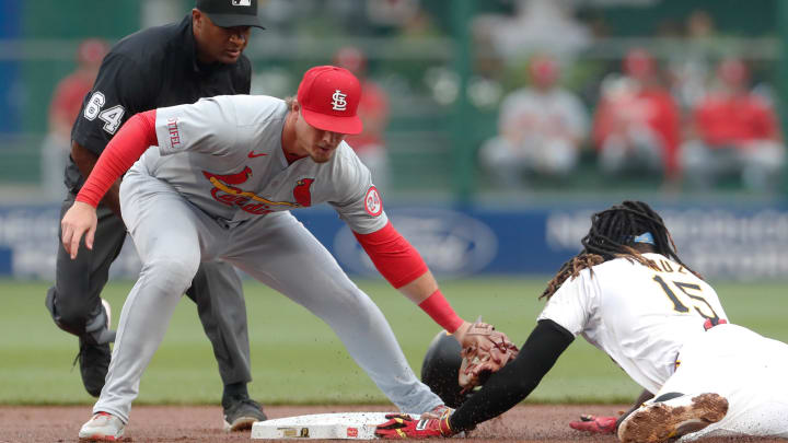 Jul 22, 2024; Pittsburgh, Pennsylvania, USA;  Pittsburgh Pirates shortstop Oneil Cruz (15) steals second base against a late tag by St. Louis Cardinals second baseman Nolan Gorman (left) during the first inning at PNC Park. Mandatory Credit: Charles LeClaire-USA TODAY Sports