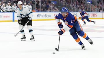 Oct 10, 2024; Elmont, New York, USA; New York Islanders left wing Anthony Duclair (11) skates with the puck against Utah Hockey Club right wing Dylan Guenther (11) during overtime at UBS Arena. Mandatory Credit: Brad Penner-Imagn Images