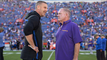Nov 16, 2024; Gainesville, Florida, USA; Florida Gators head coach Billy Napier and LSU Tigers head coach Brian Kelly talk midfield before a game at Ben Hill Griffin Stadium. Mandatory Credit: Matt Pendleton-Imagn Images