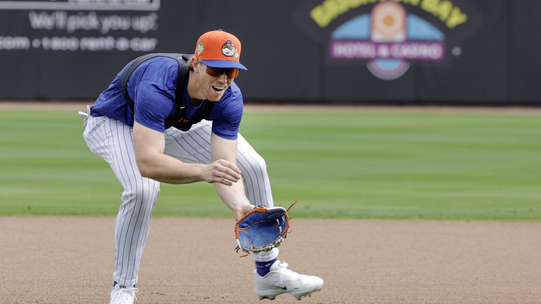 Feb 17, 2026; Port St. Lucie, FL, USA;  New York Mets third baseman Brett Baty (7) fields a ground ball during the New York Mets spring training workouts at Clover Park. Mandatory Credit: Reinhold Matay-Imagn Images