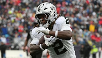 Sep 7, 2025; Foxborough, Massachusetts, USA; Las Vegas Raiders running back Ashton Jeanty (2) rushes the ball against the New England Patriots during he second half at Gillette Stadium. Mandatory Credit: Bob DeChiara-Imagn Images