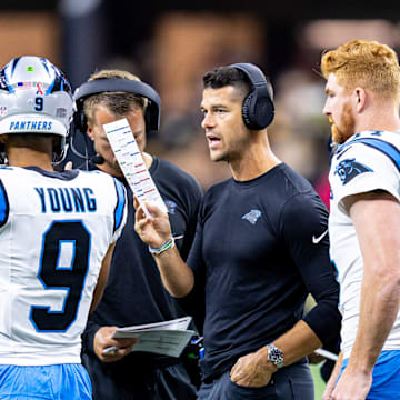 Sep 8, 2024; New Orleans, Louisiana, USA; Carolina Panthers head coach Dave Canales talks to quarterback Bryce Young (9) and quarterback Andy Dalton (14) on a time out against the New Orleans Saints during the first half at Caesars Superdome.