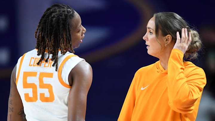 Tennessee Volunteers guard Talaysia Cooper (55) talks to Tennessee Volunteers head coach Kim Caldwell Thursday, March 5, 2026, during the SEC Women's Basketball Tournament second round game against the Alabama Crimson Tide at Bon Secours Wellness Arena in Greenville, South Carolina.