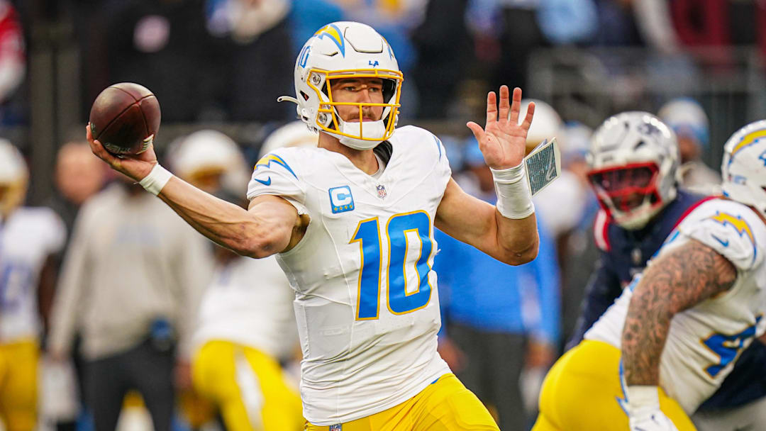 Dec 28, 2024; Foxborough, Massachusetts, USA; Los Angeles Chargers quarterback Justin Herbert (10) passes the ball against the New England Patriots in the third quarter at Gillette Stadium.