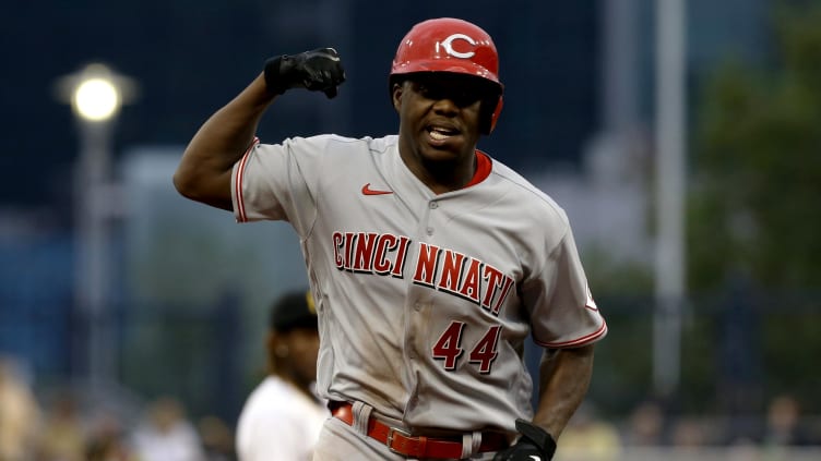 Cincinnati Reds right fielder Aristides Aquino (44) flexes.