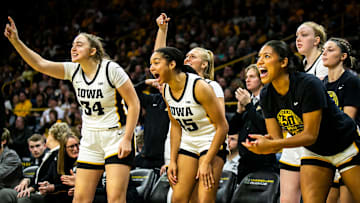 Iowa's AJ Ediger, left, and Hannah Stuelke cheer on teammates during a NCAA Big Ten Conference women's basketball game against Nebraska, Saturday, Jan. 28, 2023, at Carver-Hawkeye Arena in Iowa City, Iowa.