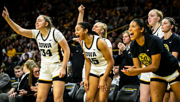 Iowa's AJ Ediger, left, and Hannah Stuelke cheer on teammates during a NCAA Big Ten Conference women's basketball game against Nebraska, Saturday, Jan. 28, 2023, at Carver-Hawkeye Arena in Iowa City, Iowa.