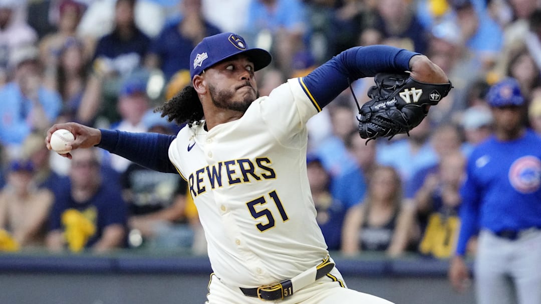 Oct 4, 2025; Milwaukee, Wisconsin, USA; Milwaukee Brewers starting pitcher Freddy Peralta (51) pitches against the Chicago Cubs during the second inning of game one of the NLDS round for the 2025 MLB playoffs at American Family Field. Mandatory Credit: Michael McLoone-Imagn Images
