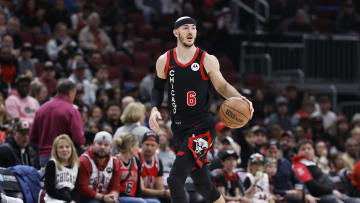Apr 1, 2024; Chicago, Illinois, USA; Chicago Bulls guard Alex Caruso (6) drives to the basket against the Atlanta Hawks during the first half at United Center. Mandatory Credit: Kamil Krzaczynski-USA TODAY Sports