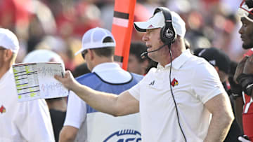 Oct 4, 2025; Louisville, Kentucky, USA; Louisville Cardinals head coach Jeff Brohm calls out instructions during the second quarter against the Virginia Cavaliers at L&N Federal Credit Union Stadium. Virginia defeated Louisville 30-27. Mandatory Credit: Jamie Rhodes-Imagn Images