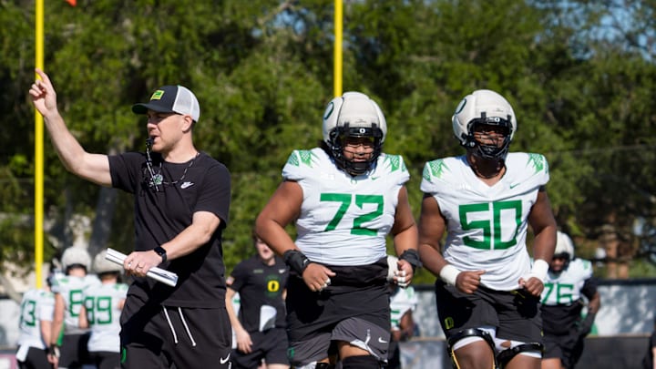 Oregon offensive coordinator Will Stein walks the field as the Oregon Ducks practice at Barry University ahead of the Orange Bowl on Dec. 30, 2025, in Miami, Florida.