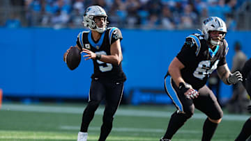 Nov 9, 2025; Charlotte, North Carolina, USA;  Carolina Panthers quarterback Bryce Young (9) looks to pass during the third quarter against the New Orleans Saints at Bank of America Stadium. Mandatory Credit: Jim Dedmon-Imagn Images