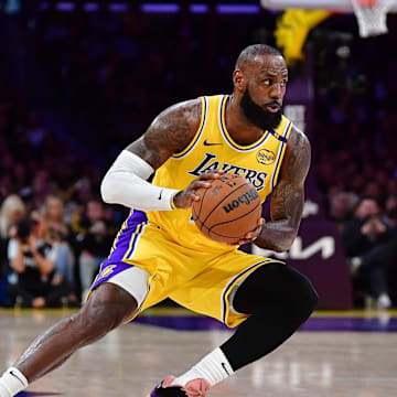 Apr 30, 2025; Los Angeles, California, USA; Los Angeles Lakers forward LeBron James (23) controls the ball against the Minnesota Timberwolves during the first half in game five of first round for the 2025 NBA Playoffs at Crypto.com Arena. Mandatory Credit: Gary A. Vasquez-Imagn Images