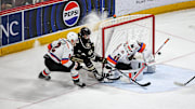 Bogdan Trineyev (44) tries to stuff the puck through Cal Peterson (40). The Lehigh Valley Phantoms played the Hershey Bears in the 1st game of the Calder Cup Semi-finals at the Giant Center in Hershey on May 1, 2024. The Bears won game one 2-1 and now lead the series 1-0.