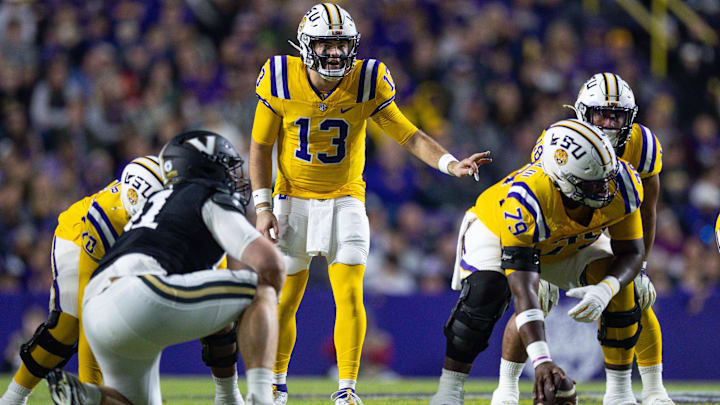 Nov 23, 2024; Baton Rouge, Louisiana, USA; LSU Tigers quarterback Garrett Nussmeier (13) looks over the Vanderbilt Commodores defense during the first half at Tiger Stadium. Mandatory Credit: Stephen Lew-Imagn Images Nov 23, 2024; Baton Rouge, Louisiana, USA; LSU Tigers quarterback Garrett Nussmeier (13) looks over the Vanderbilt Commodores defense during the first half at Tiger Stadium. Mandatory Credit: Stephen Lew-Imagn Images