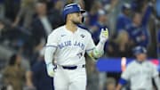 Nov 1, 2025; Toronto, Ontario, CAN; Toronto Blue Jays designated hitter Bo Bichette (11) reacts after hitting a three run home run against the Los Angeles Dodgers in the third inning during game seven of the 2025 MLB World Series at Rogers Centre. Mandatory Credit: John E. Sokolowski-Imagn Images