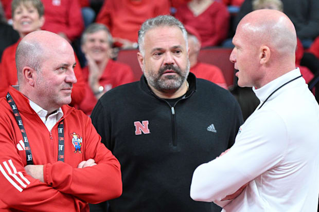 Nebraska Cornhuskers athletic director Troy Dannen and football coach Matt Rhule, and 1890's Matt Davison.