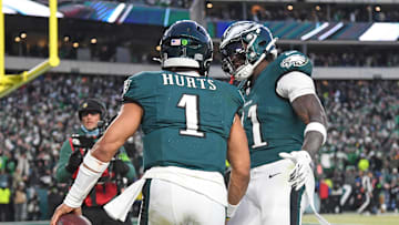 Jan 26, 2025; Philadelphia, PA, USA; Philadelphia Eagles wide receiver A.J. Brown (11) and quarterback Jalen Hurts (1) celebrate a touchdown  against the Washington Commanders in the NFC Championship game at Lincoln Financial Field. Mandatory Credit: Eric Hartline-Imagn Images