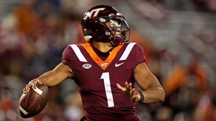 Nov 18, 2023; Blacksburg, Virginia, USA; Virginia Tech Hokies quarterback Kyron Drones (1) throws a pass against the North Carolina State Wolfpack at Lane Stadium. Mandatory Credit: Peter Casey-USA TODAY Sports