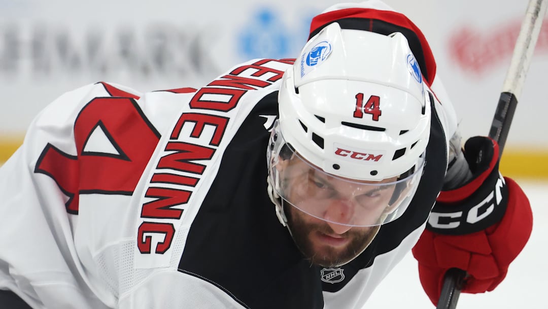 Jan 8, 2026; Pittsburgh, Pennsylvania, USA;  New Jersey Devils center Luke Glendening (14) waits for the puck drop on a face-off against the Pittsburgh Penguins during the second period at PPG Paints Arena.