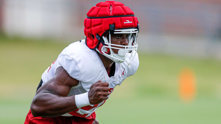 Samuel Omosigho (24) runs drills during an OU football practice in Norman, Okla., on Monday, Aug. 7, 2023.