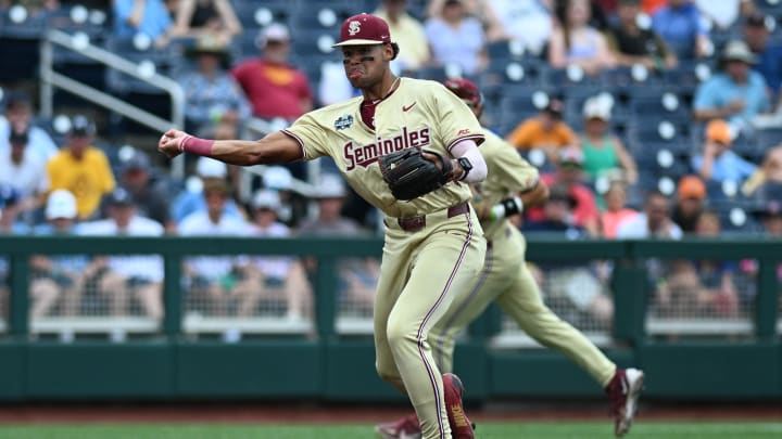 Jun 18, 2024; Omaha, NE, USA; Florida State Seminoles third baseman Cam Smith (24) throws to first base against the North Carolina Tar Heels during the first inning at Charles Schwab Field Omaha. 