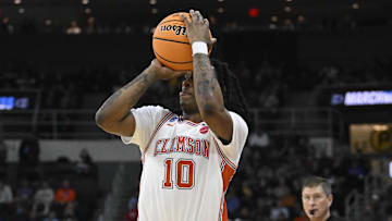 Mar 20, 2025; Providence, RI, USA; Clemson Tigers guard Del Jones (10) shoots the ball against McNeese State Cowboys forward Christian Shumate (24) during the first half at Amica Mutual Pavilion.