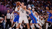May 15, 2025; Denver, Colorado, USA; Denver Nuggets center Nikola Jokic (15) controls the ball under pressure form Oklahoma City Thunder guard Alex Caruso (9) in the second quarter during game six of the second round for the 2025 NBA Playoffs at Ball Arena. Mandatory Credit: Isaiah J. Downing-Imagn Images