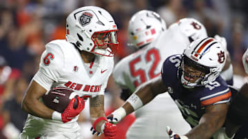 Sep 14, 2024; Auburn, Alabama, USA; Auburn Tigers defensive lineman Keldric Faulk (15) dives to tackle New Mexico Lobos running back Eli Sanders (6) during the second quarter at Jordan-Hare Stadium. Mandatory Credit: John Reed-Imagn Images