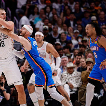 May 15, 2025; Denver, Colorado, USA; Denver Nuggets center Nikola Jokic (15) controls the ball under pressure form Oklahoma City Thunder guard Alex Caruso (9) in the second quarter during game six of the second round for the 2025 NBA Playoffs at Ball Arena. Mandatory Credit: Isaiah J. Downing-Imagn Images