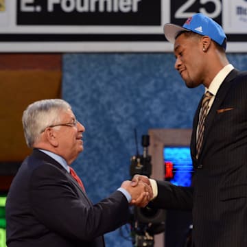 June 28, 2012; Newark, NJ, USA; Perry Jones III (Baylor), right, is introduced as the number twenty-eight overall pick to the Oklahoma City Thunder by NBA commissioner David Stern during the 2012 NBA Draft at the Prudential Center.  Mandatory Credit: Jerry Lai-Imagn Images