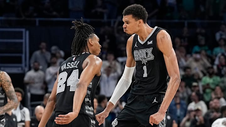 Mar 17, 2024; Austin, Texas, USA; San Antonio Spurs forward Victor Wembanyama (1) and guard Devin Vassell (24) react during overtime against the Brooklyn Nets at Moody Center. Mandatory Credit: Scott Wachter-Imagn Images