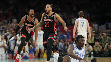 Apr 5, 2025; San Antonio, TX, USA; Houston Cougars guard Emanuel Sharp (21) and Houston Cougars forward J'Wan Roberts (13) celebrate defeating the Duke Blue Devils in the semifinals of the men's Final Four of the 2025 NCAA Tournament at the Alamodome. Mandatory Credit: Robert Deutsch-Imagn Images
