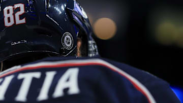 Sep 28, 2022; Columbus, Ohio, USA;  The NHL Unity and Equality sticker on the helmet of Columbus Blue Jackets left wing Mikael Pyyhtia (82) is seen as he skates during warmups prior to the game against the Buffalo Sabres at Nationwide Arena. Mandatory Credit: Aaron Doster-Imagn Images