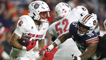 Sep 14, 2024; Auburn, Alabama, USA; Auburn Tigers defensive lineman Keldric Faulk (15) dives to tackle New Mexico Lobos running back Eli Sanders (6) during the second quarter at Jordan-Hare Stadium. Mandatory Credit: John Reed-Imagn Images