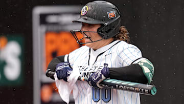 Rachel Garcia, AUSL All-Star Cup pitcher and member of Team Lorenz, dries off her bat as a member of Team McQuillin during an Athletes Unlimited Pro Championship (the former name of the league) game against Team Kilfoyl at Max R. Joyner Stadium on Aug. 7. 2024 in Greenville, N.C.