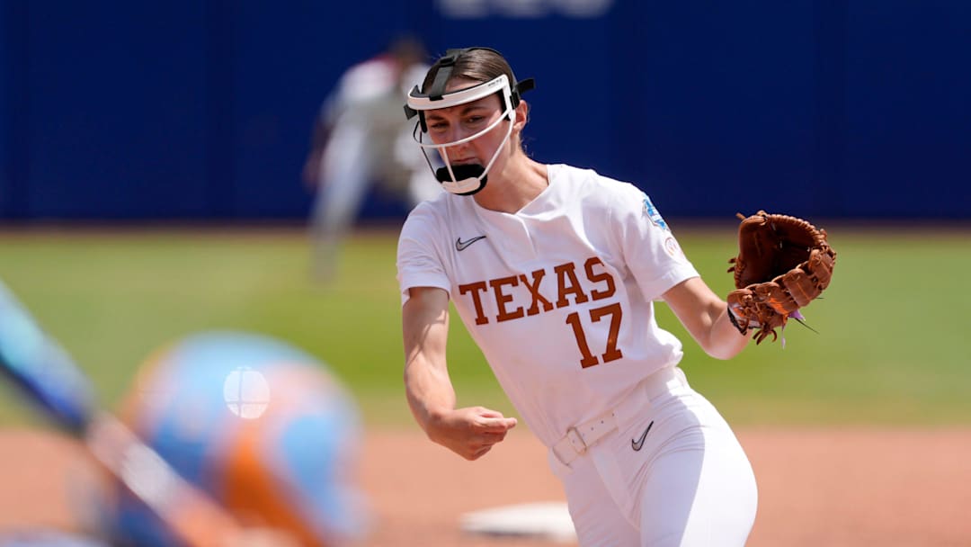 Texas Longhorns pitcher Teagan Kavan throws a pitch a Women's College World Series softball game.