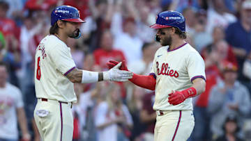 Oct 6, 2024; Philadelphia, Pennsylvania, USA; Philadelphia Phillies outfielder Nick Castellanos (8) congratulates first base Bryce Harper (3) after hitting a home-run in the sixth inning against the New York Mets  during game two of the NLDS for the 2024 MLB Playoffs at Citizens Bank Park. Mandatory Credit: Bill Streicher-Imagn Images