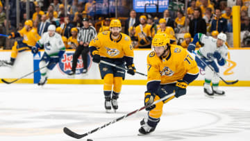 May 3, 2024; Nashville, Tennessee, USA; Nashville Predators right wing Luke Evangelista (77) skates with the puck against the Vancouver Canucks during the first period in game six of the first round of the 2024 Stanley Cup Playoffs at Bridgestone Arena. Mandatory Credit: Steve Roberts-USA TODAY Sports