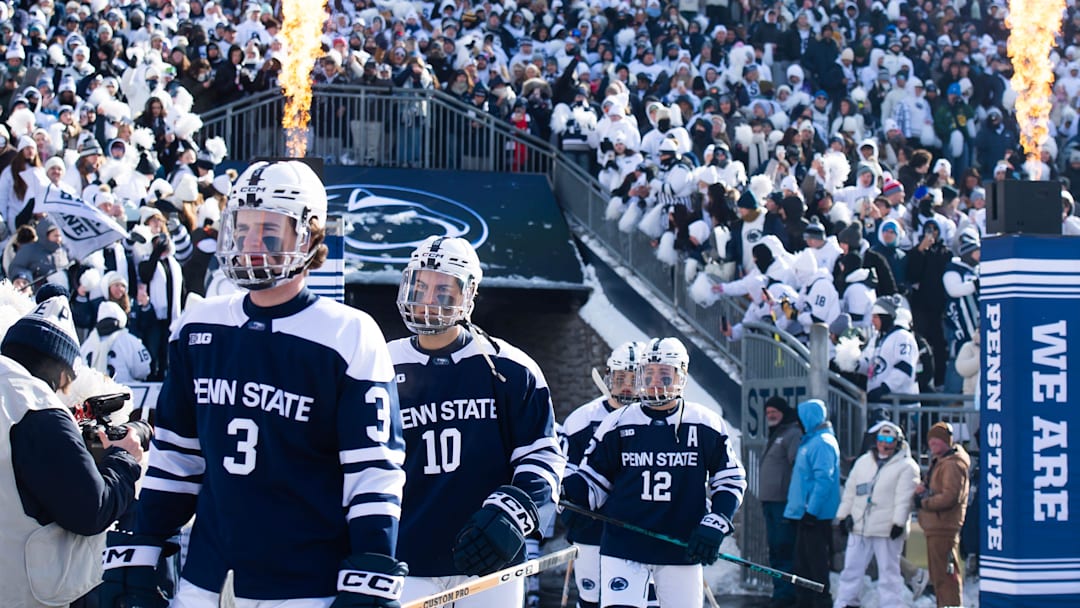 Penn State Nittany Lions ice hockey players enter Beaver Stadium for a top-five Big Ten game against Michigan State.