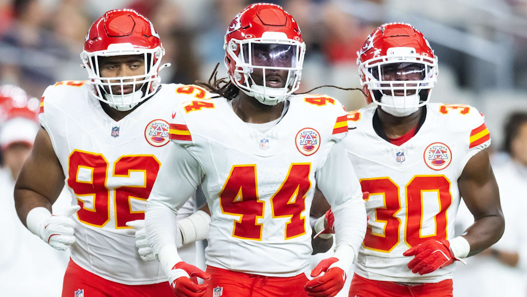 Kansas City Chiefs linebacker Cam Jones (44) with defensive tackle Marlon Tuipulotu (92) and running back Brashard Smith (30) against the Arizona Cardinals during a preseason NFL game at State Farm Stadium.
