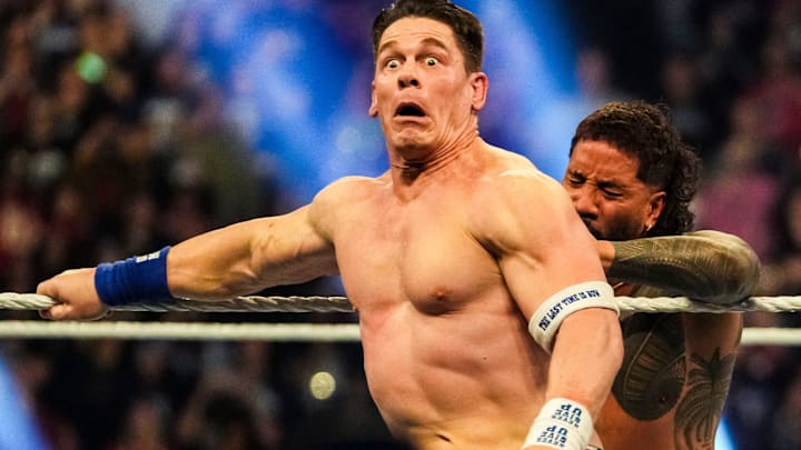 Jey Uso pushes John Cena off the ring Saturday, Feb. 1, 2025, during the WWE Royal Rumble at Lucas Oil Stadium in Indianapolis.