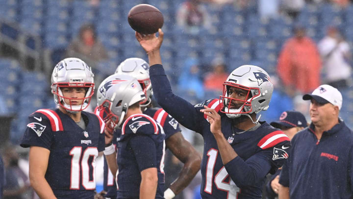 August 8, 2024; Foxborough, MA, USA;  New England Patriots quarterback Jacoby Brissett (14) warms up before a game against the Carolina Panthers at Gillette Stadium. Mandatory Credit: Eric Canha-USA TODAY Sports