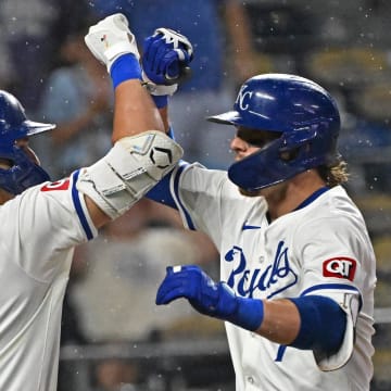 Jul 2, 2024; Kansas City, Missouri, USA; Kansas City Royals shortstop Bobby Witt Jr. (7) celebrates with Vinnie Pasquantino (9) after hitting a solo home run in the sixth inning against the Tampa Bay Rays at Kauffman Stadium. Mandatory Credit: Peter Aiken-USA TODAY Sports