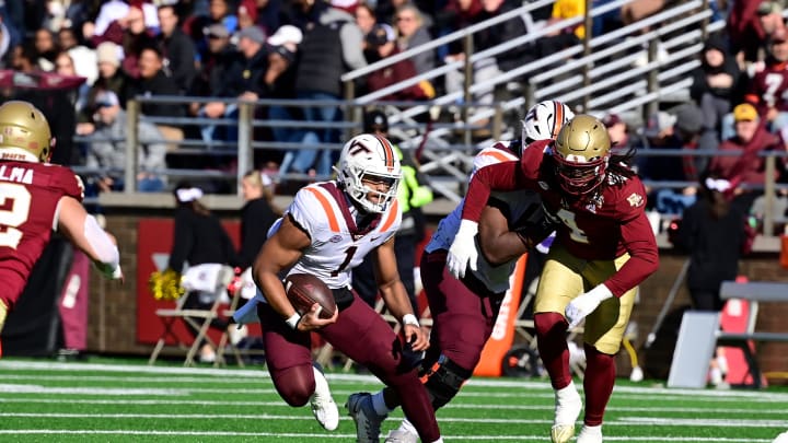 Nov 11, 2023; Chestnut Hill, Massachusetts, USA; Virginia Tech Hokies quarterback Kyron Drones (1) runs the ball during the first half against the Boston College Eagles at Alumni Stadium. Mandatory Credit: Eric Canha-USA TODAY Sports