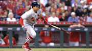 Jun 7, 2017; Cincinnati, OH, USA; St. Louis Cardinals shortstop Aledmys Diaz hits a single against the Cincinnati Reds during the sixth inning at Great American Ball Park. Mandatory Credit: David Kohl-Imagn Images