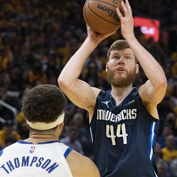 May 20, 2022; San Francisco, California, USA; Dallas Mavericks forward Davis Bertans (44) shoots the basketball against Golden State Warriors guard Klay Thompson (11) during the second quarter in game two of the 2022 western conference finals at Chase Center. Mandatory Credit: Kyle Terada-USA TODAY Sports