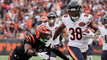 Chicago Bears running back Brittain Brown (38) runs for a touchdown against Cincinnati Bengals safety Jordan Battle (27) and cornerback DJ Turner II (20) during the third quarter at Paycor Stadium.